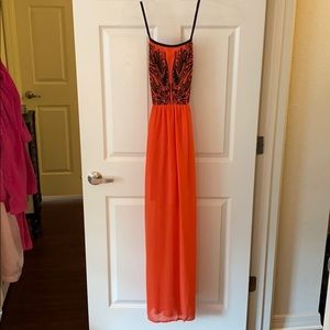 Red strappy dress with blue detailing